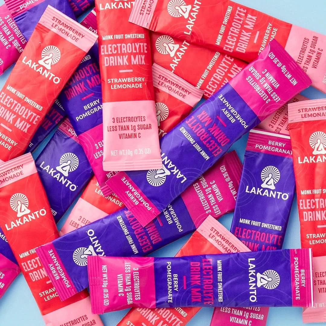 Lakantos Sugar Free Hydration Pack Electrolyte Drink Mix Variety Pack features vibrant packets in red, purple, and pink. Enjoy refreshing flavors like strawberry lemonade and pomegranate, enhanced with monk fruit sweetening, essential electrolytes, and vitamin C for a revitalizing boost.