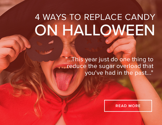 A little girl is wearing a witches hat and holding two black paper pumpkins over her eyes. Words over the image: 4 Ways to Replace Candy on Halloween: ...this year just do one thing to reduce the sugar overload that you've had in the past..." 