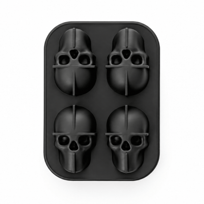 A black silicone mold with four skull-shaped cavities, shown from a top-down view on a solid white background.